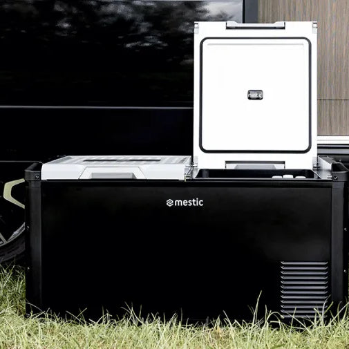 Mestic MCCP-75 dual zone compressor cool box with lid open outside a caravan - My Mestic