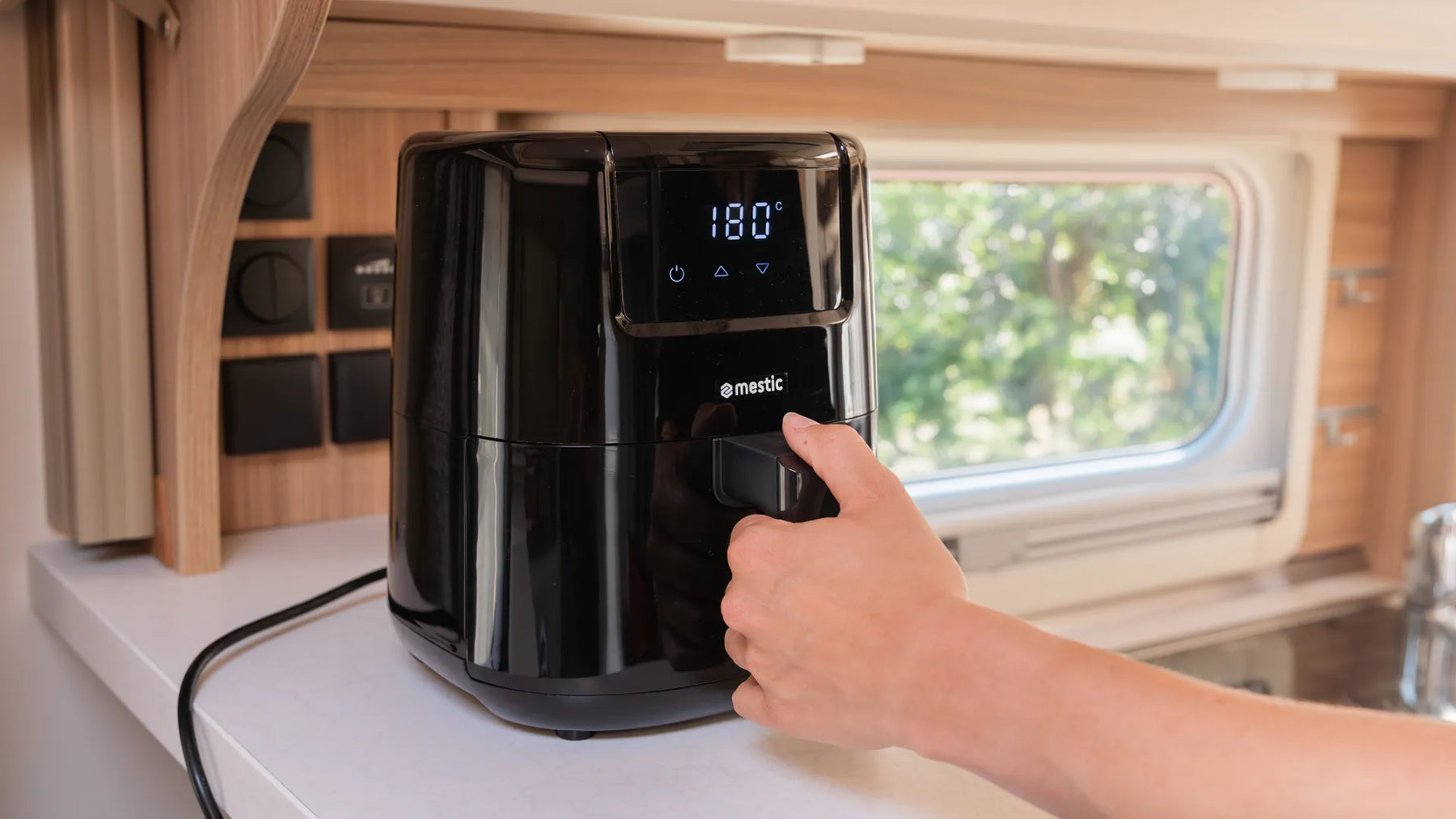 Mestic MA-300 air fryer sitting on a motorhome kitchen counter — compact caravan cooking