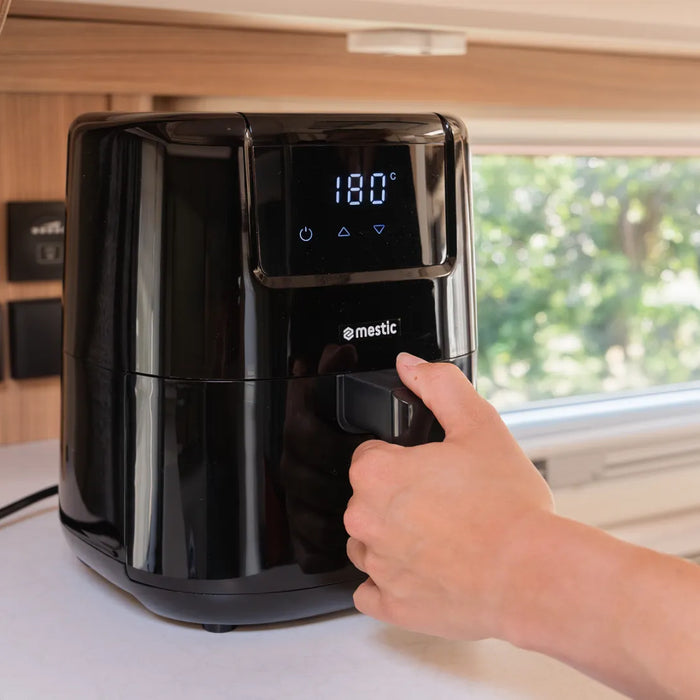 Compact Mestic air fryer in a motorhome interior — easy cooking without the oil