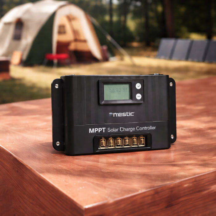 Camping setup with a Mestic solar charge controller in the foreground and folding panel charging