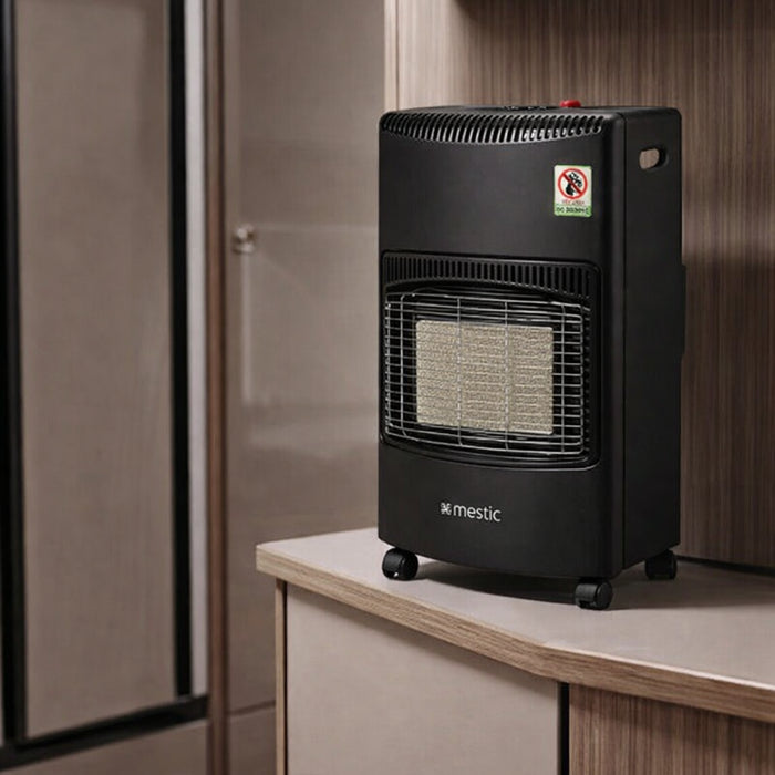 Compact Mestic gas heater warming the interior of a caravan on a cold evening