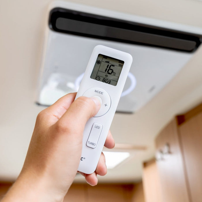 Remote-controlled Mestic rooftop AC inside a caravan — adjusting cooling from the comfort of your seat